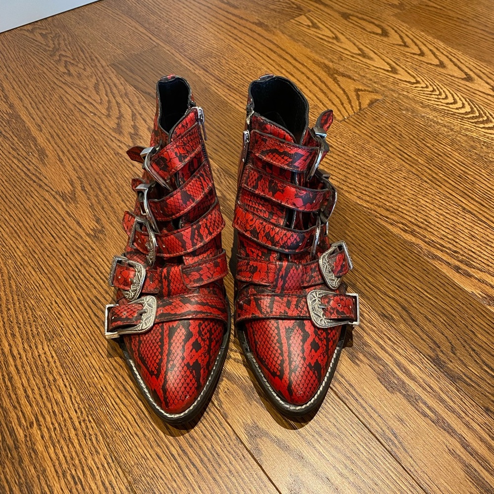 Red “snake skin” ankle booties with silver detailing